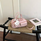 playful mini handbag with charming animal charm