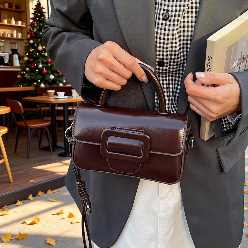 mini handbag with detachable shoulder strap and modern design