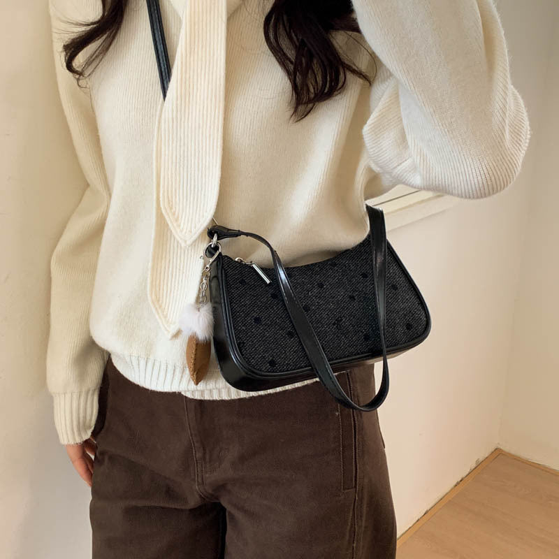 Women trendy mini handbag with playful animal pendant