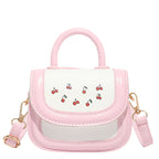 mini handbag with cheerful cherry design and charming charms