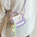 mini handbag with cheerful cherry design and charming charms