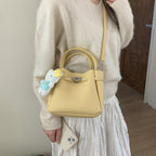 mini handbag with fluffy pendant