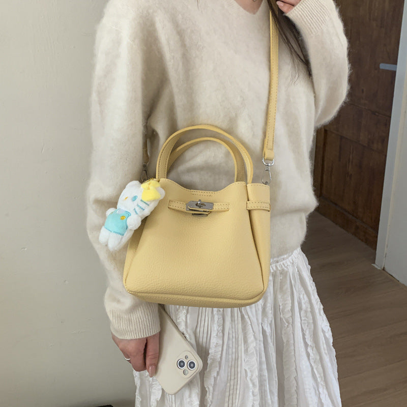 mini handbag with fluffy pendant