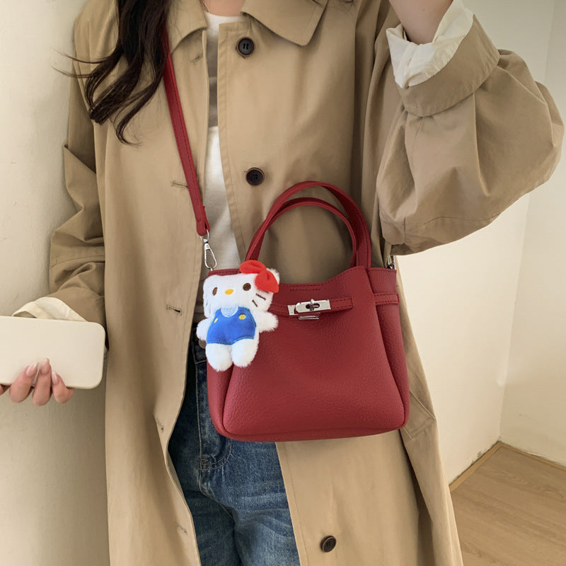 mini handbag with fluffy pendant