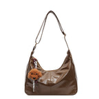 Shoulder bag with charming animal pendant