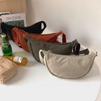 Shoulder bag with practical compartment system and adjustable shoulder strap