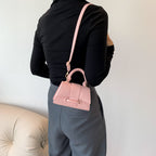mini handbag with textured leather and stylish closure
