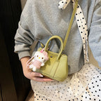 Ladies Mini Handbag with Playful Plush Pendant