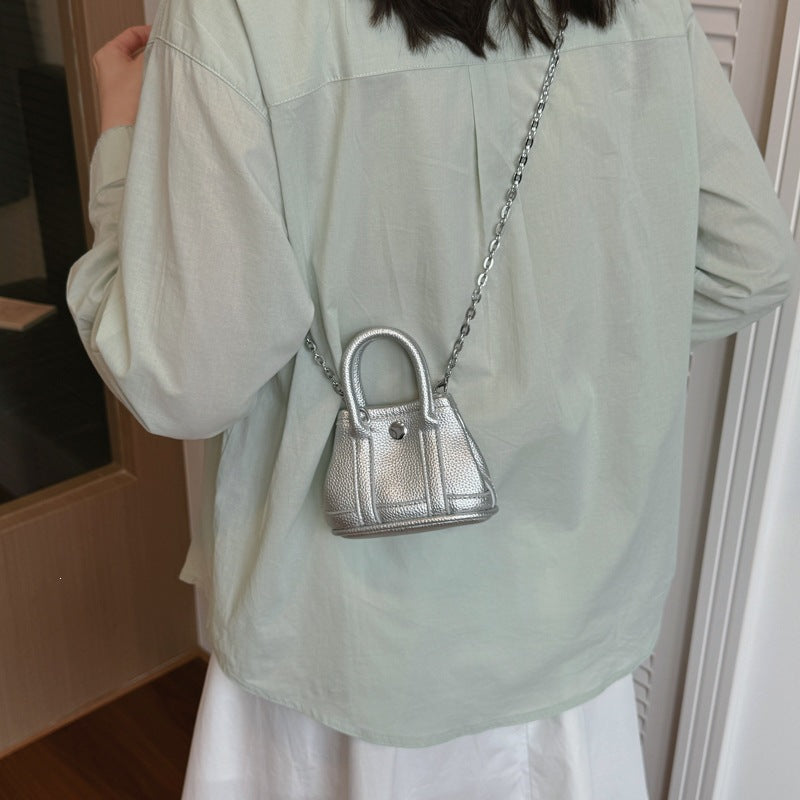 mini handbag with supple structure and detachable chain strap