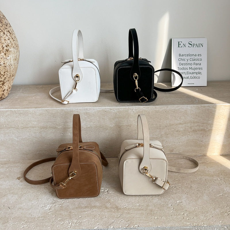 Women’s mini handbag with detachable shoulder strap and elegant flap closure