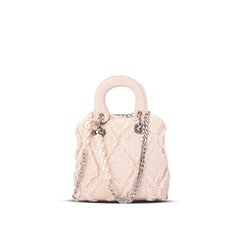 mini handbag with striking cinched design and pearl accents