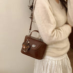 Ladies elegant mini handbag with stylish pendant