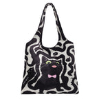 Shoulder bag with playful cat motif