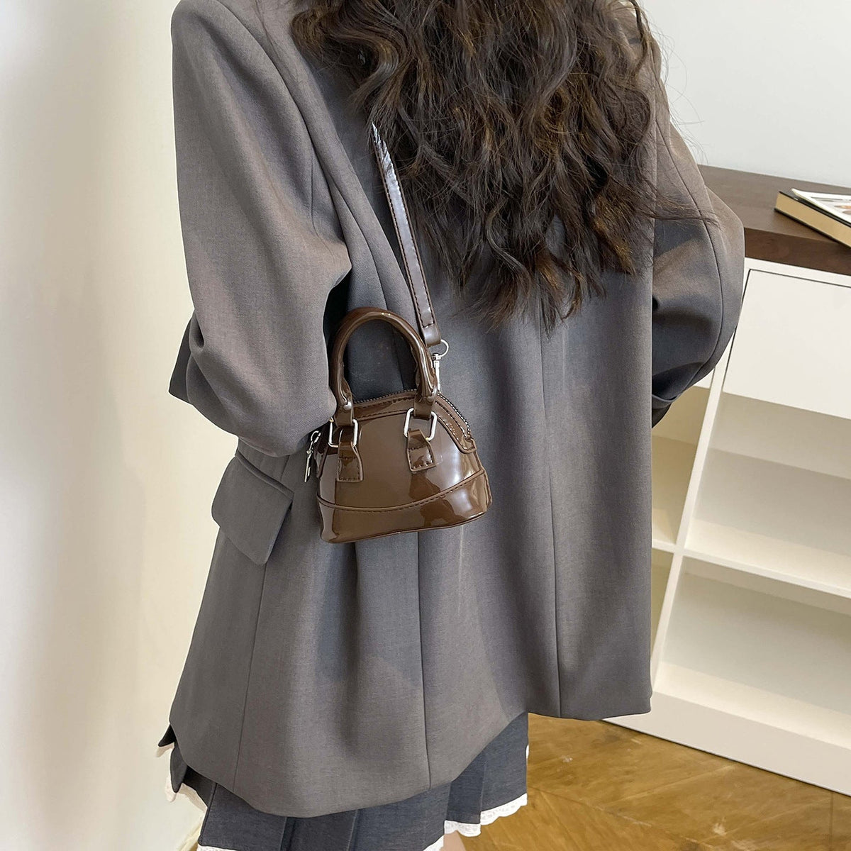 mini handbag with shiny surface and trendy zipper
