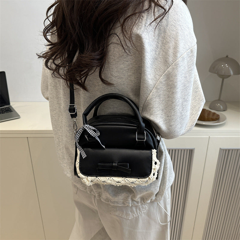 mini handbag with playful bow accent and floral details