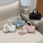 playful mini handbag with charming animal charm
