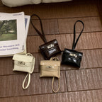 mini handbag made of high-quality synthetic leather with playful closure