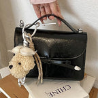 Ladies elegant mini handbag with cute pendant