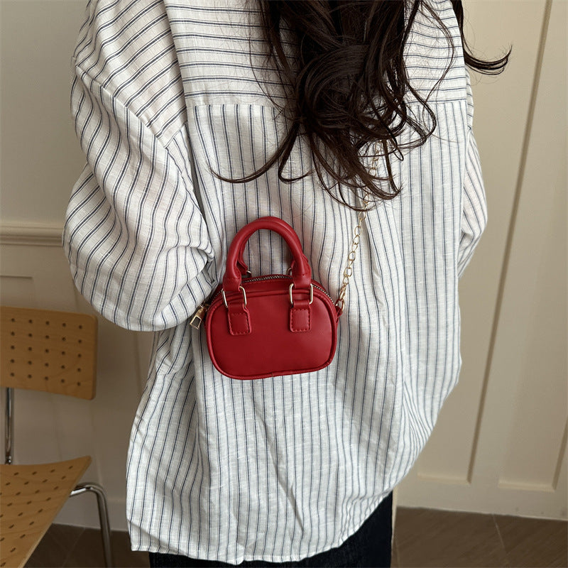 mini handbag with detachable chain and elegant design