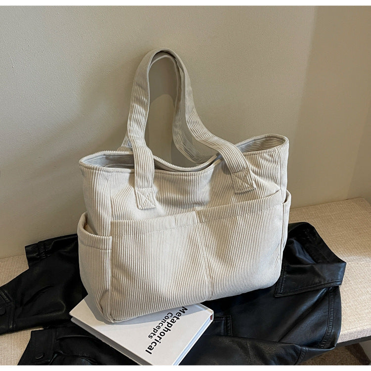 Multifunctional shoulder bag with large outer pockets