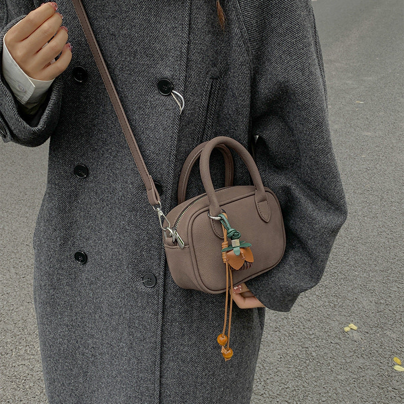 mini handbag with detachable shoulder strap and elegant design