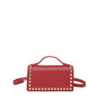 mini handbag with glittering upper material and golden studs