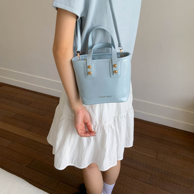Women’s mini handbag with elegant carrying handle and practical inner compartment