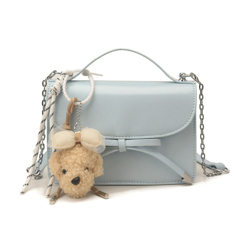 Ladies elegant mini handbag with cute pendant