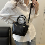 elegant mini handbag with textured design and detachable shoulder strap