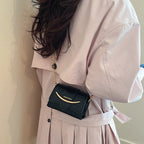 mini handbag with modern crocodile embossing and chic magnetic closure