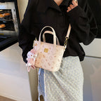 Women’s mini handbag in a charming design with removable pendant