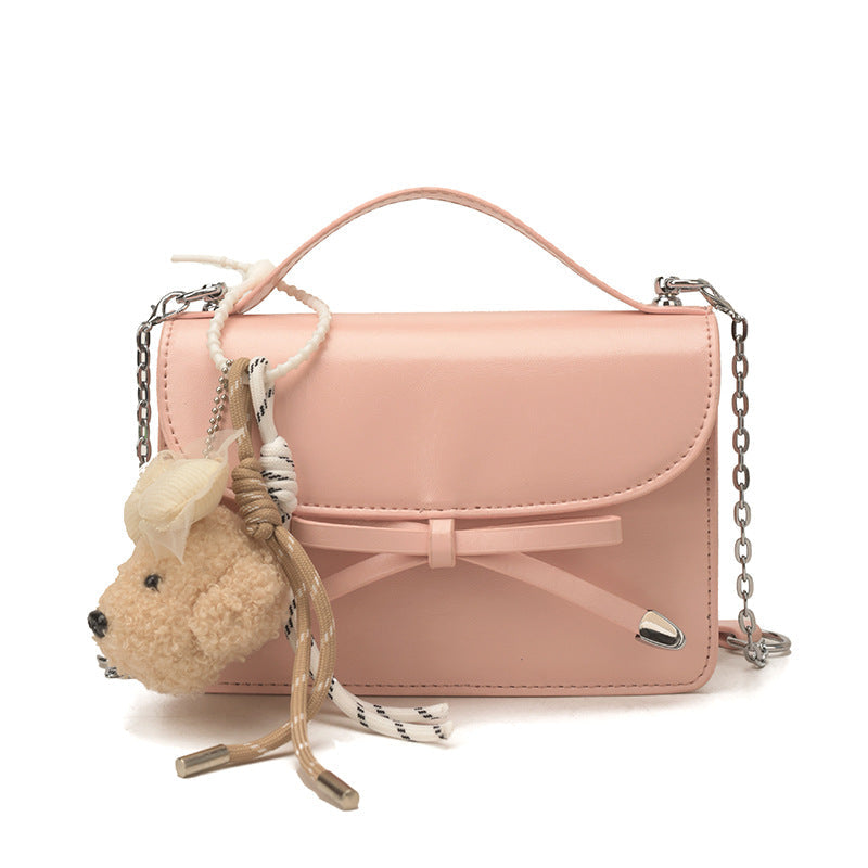 Ladies elegant mini handbag with cute pendant