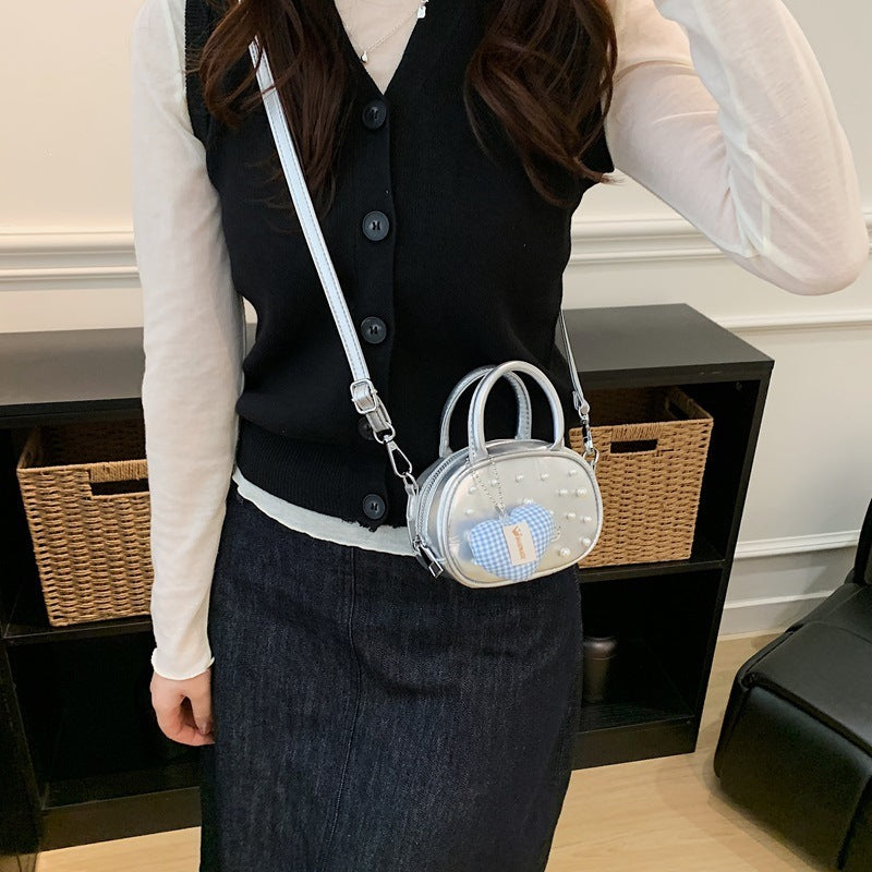 Ladies trendy mini handbag with striking pearl applications Nord bags