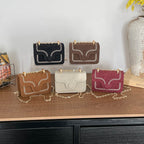 mini handbag with elegant quilted pattern and golden accents