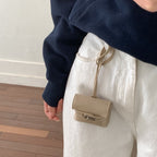 mini handbag made of high-quality synthetic leather with playful closure