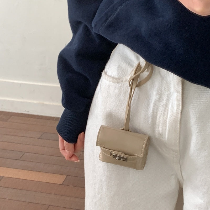 mini handbag made of high-quality synthetic leather with playful closure