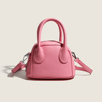 mini handbag with textured upper material and removable shoulder strap