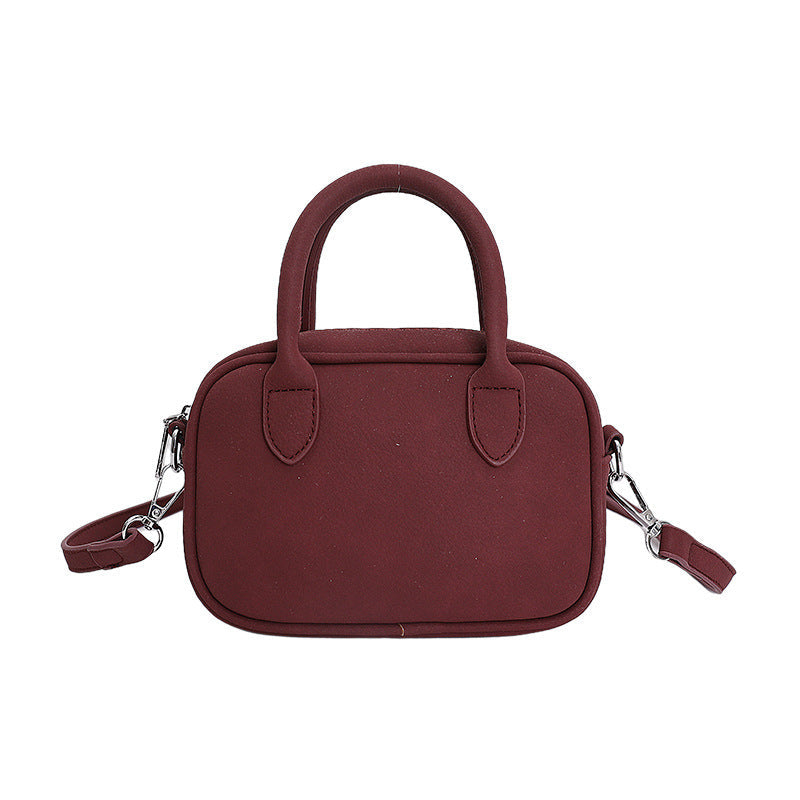 mini handbag with detachable shoulder strap and elegant design