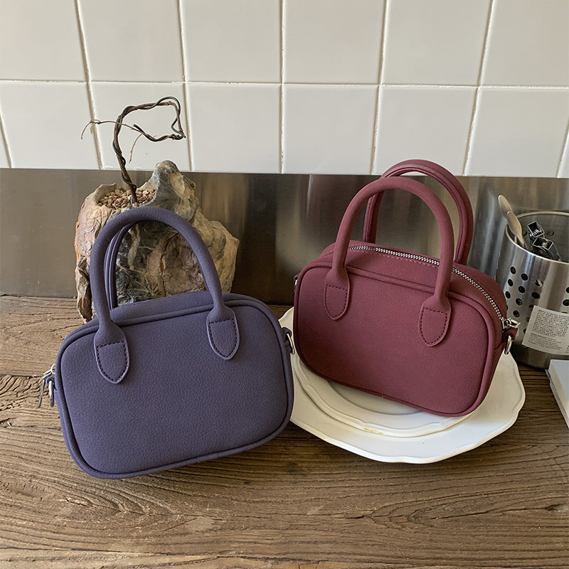 mini handbag with detachable shoulder strap and elegant design
