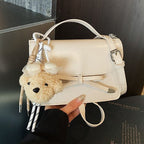 Ladies elegant mini handbag with cute pendant
