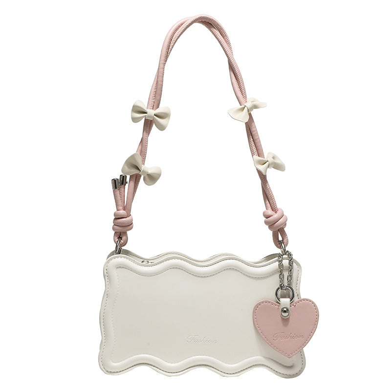 mini handbag with creative wave pattern and playful pendant