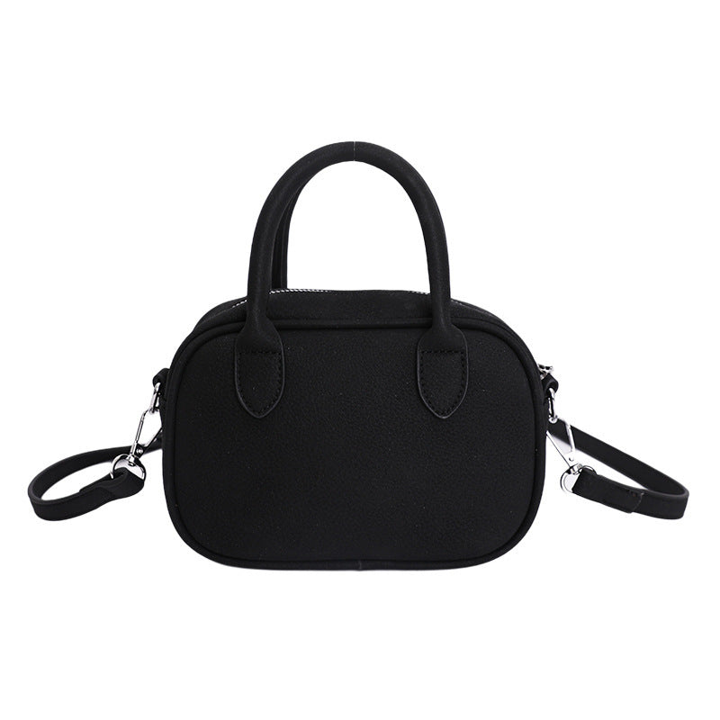 mini handbag with detachable shoulder strap and elegant design