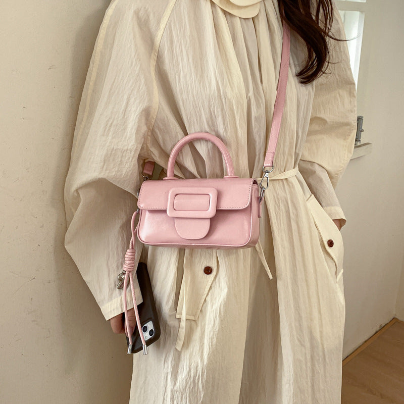 mini handbag with decorative snap closure