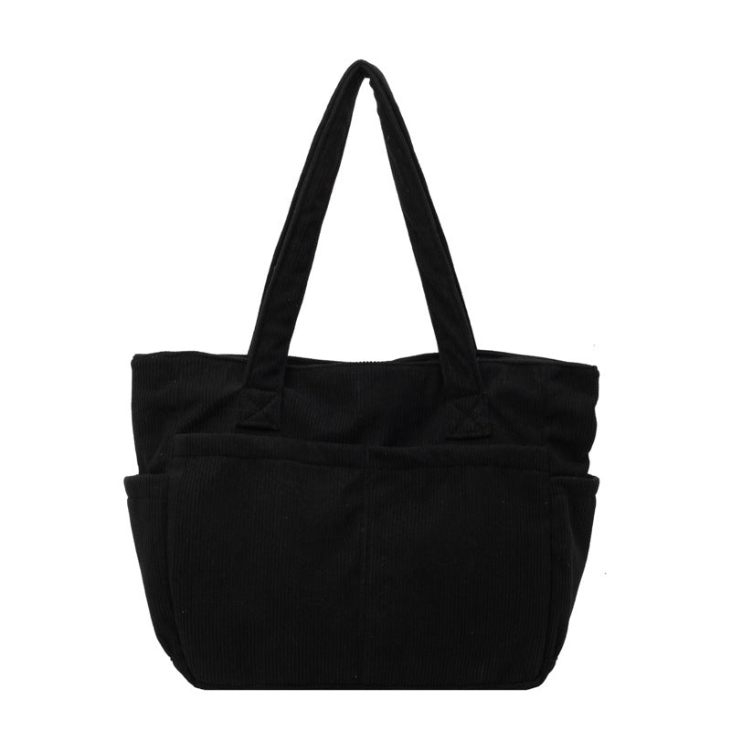 Multifunctional shoulder bag with large outer pockets