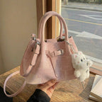 mini handbag with modern accents and practical interior organizer