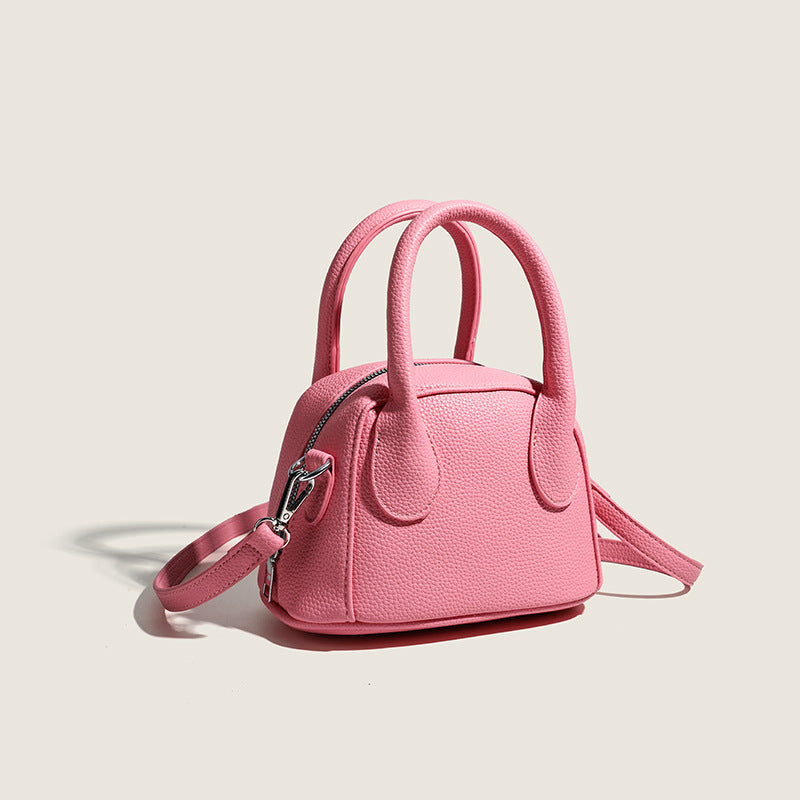mini handbag with textured upper material and removable shoulder strap