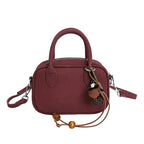 mini handbag with detachable shoulder strap and elegant design