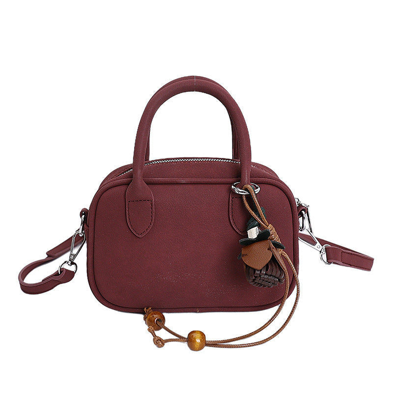 mini handbag with detachable shoulder strap and elegant design